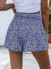 Blue floral chino shorts with elastic waist and ruffled hem