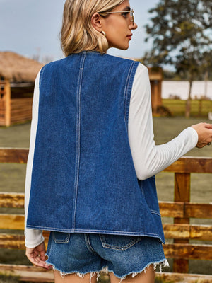 Dark blue denim vest with red heart buttons, casual buttoned outerwear.