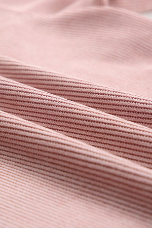 Dusty pink polyester sweatshirt with ribbed texture and XOXO appliqué detail.