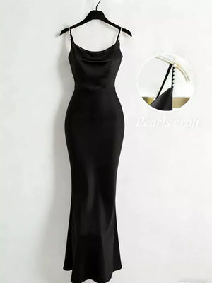 Black cowl neck maxi dress with pearl strap detail.