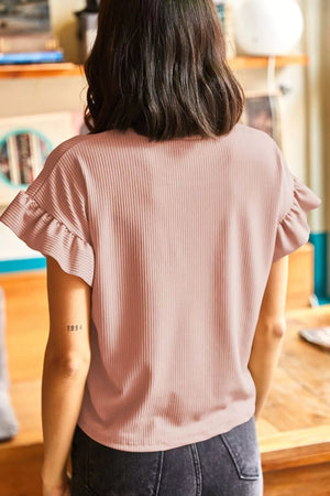 Pink ribbed t-shirt with ruffled short sleeves and relaxed fit