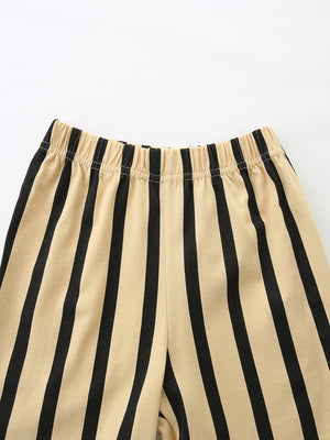 Baby shorts with beige and black vertical stripes and elastic waistband.