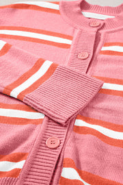 Pink striped knit cardigan with button front and ribbed cuffs.