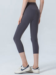 Charcoal sculpted crop leggings with a high waist and V-seam detail.