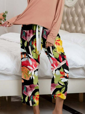 Botanical print lounge pants with drawstring waist and matching long sleeve top.