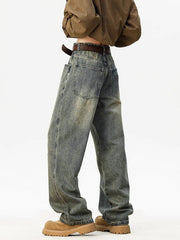 Distressed blue wide leg jeans with a relaxed fit and worn details.