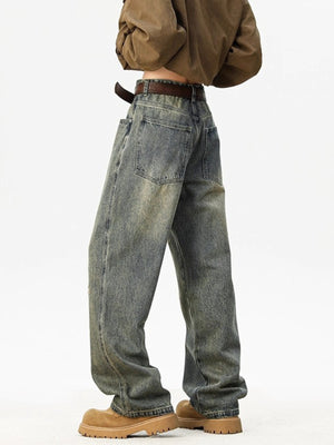 Distressed blue wide leg jeans with a relaxed fit and worn details.