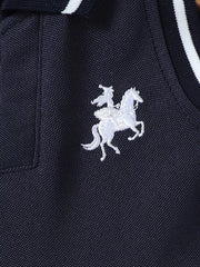 Navy polo dress with white equestrian embroidery and striped collar detail.