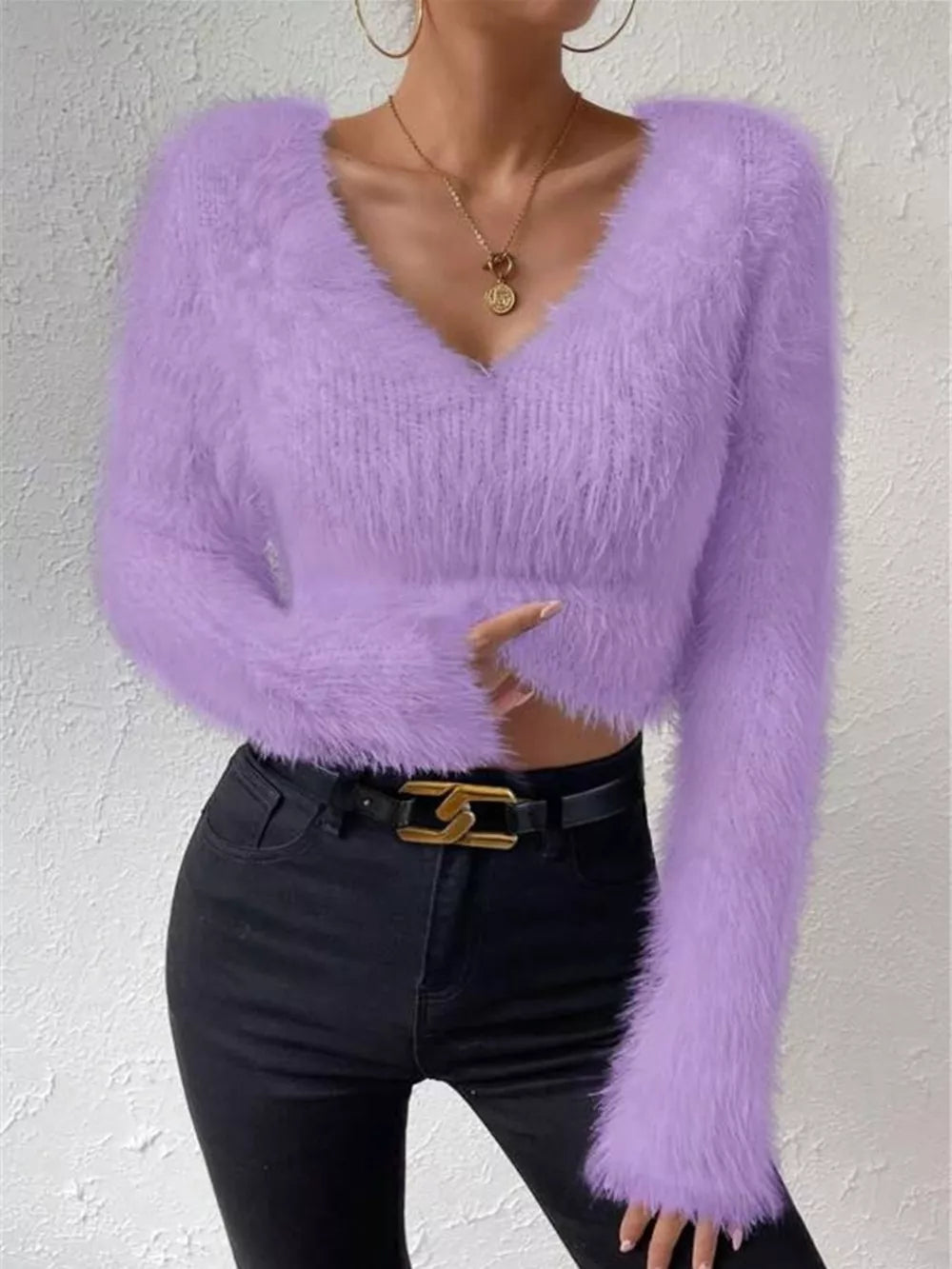 Lavender fluffy v-neck knit top with long sleeves and a cropped fit.