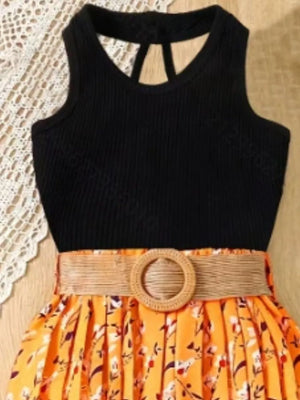 Black ribbed tank top with cutout back and orange floral pleated skirt with belted waist