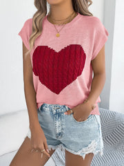 Blush pink cable knit sweater vest with a large red cable knit heart graphic.