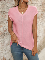 Blush pink seamed knit sleeveless v-neck top with a casual fit.
