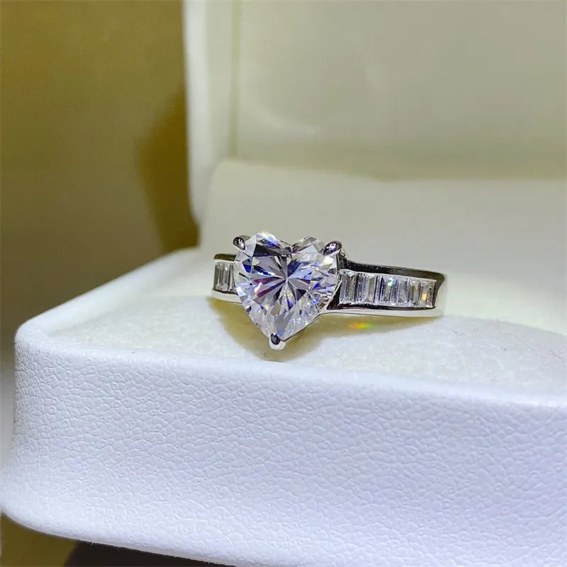 Silver ring with heart-cut moissanite and baguette stones