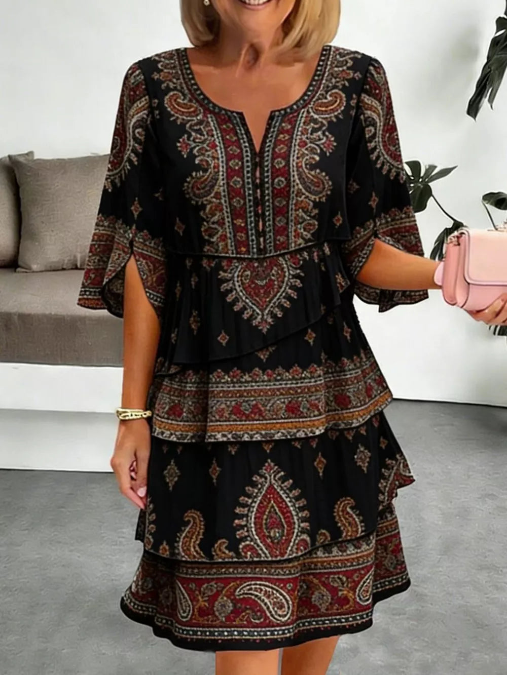 Black paisley print tiered mini dress with split sleeves and V-neck
