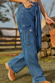 Medium wash denim cargo pants with drawstring waist and pleated cargo pockets.