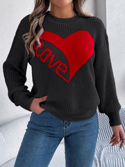 Black knit sweater with red heart and "love" graphic, crew neck, long sleeves.