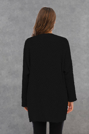 Black textured cocoon cardigan with patch pockets, long sleeves and open front.