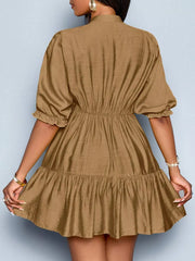 Brown tiered dress with ruffled sleeves and cinched waist.