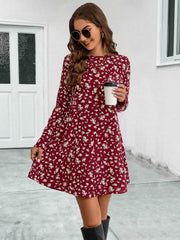 Deep red floral swing mini dress with long sleeves and round neckline.
