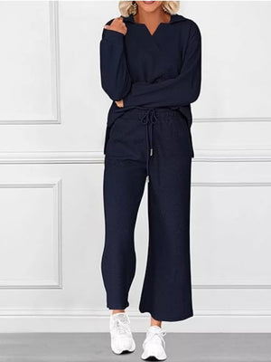 Navy blue V-neck textured lounge set with diagonal pattern, long sleeves, and drawstring pants.
