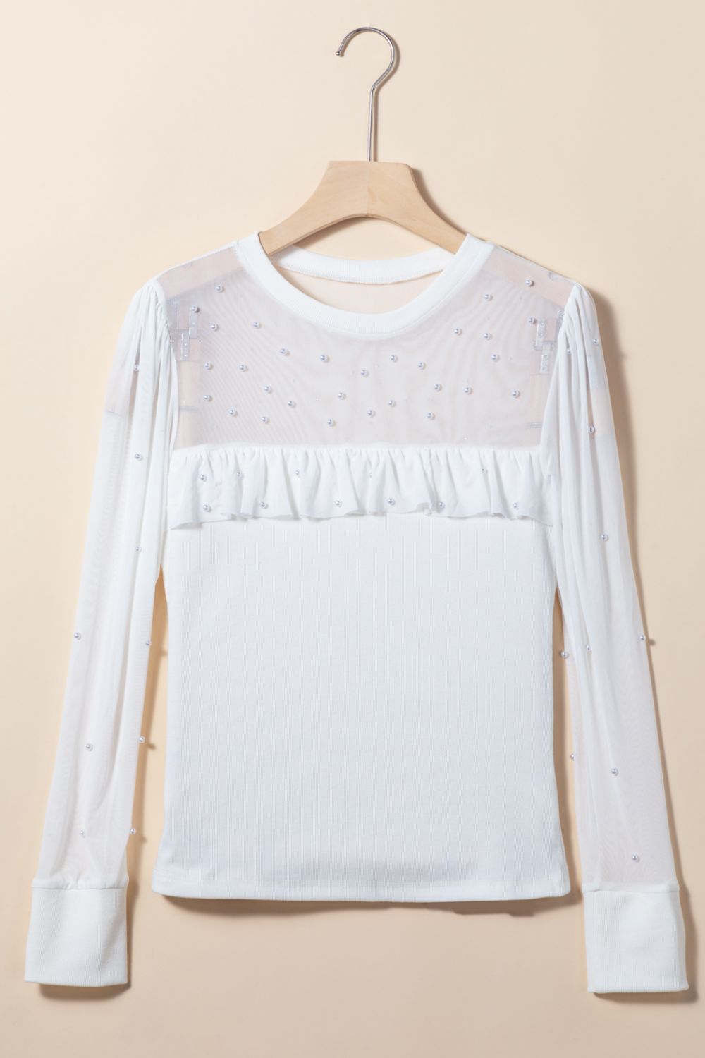 White mesh yoke bodysuit with pearl embellishments and ruffled detail