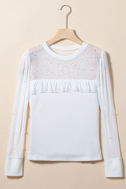 White mesh yoke bodysuit with pearl embellishments and ruffled detail