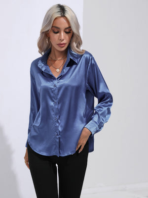 Royal blue satin tie-front blouse with buttoned front and collared neckline.