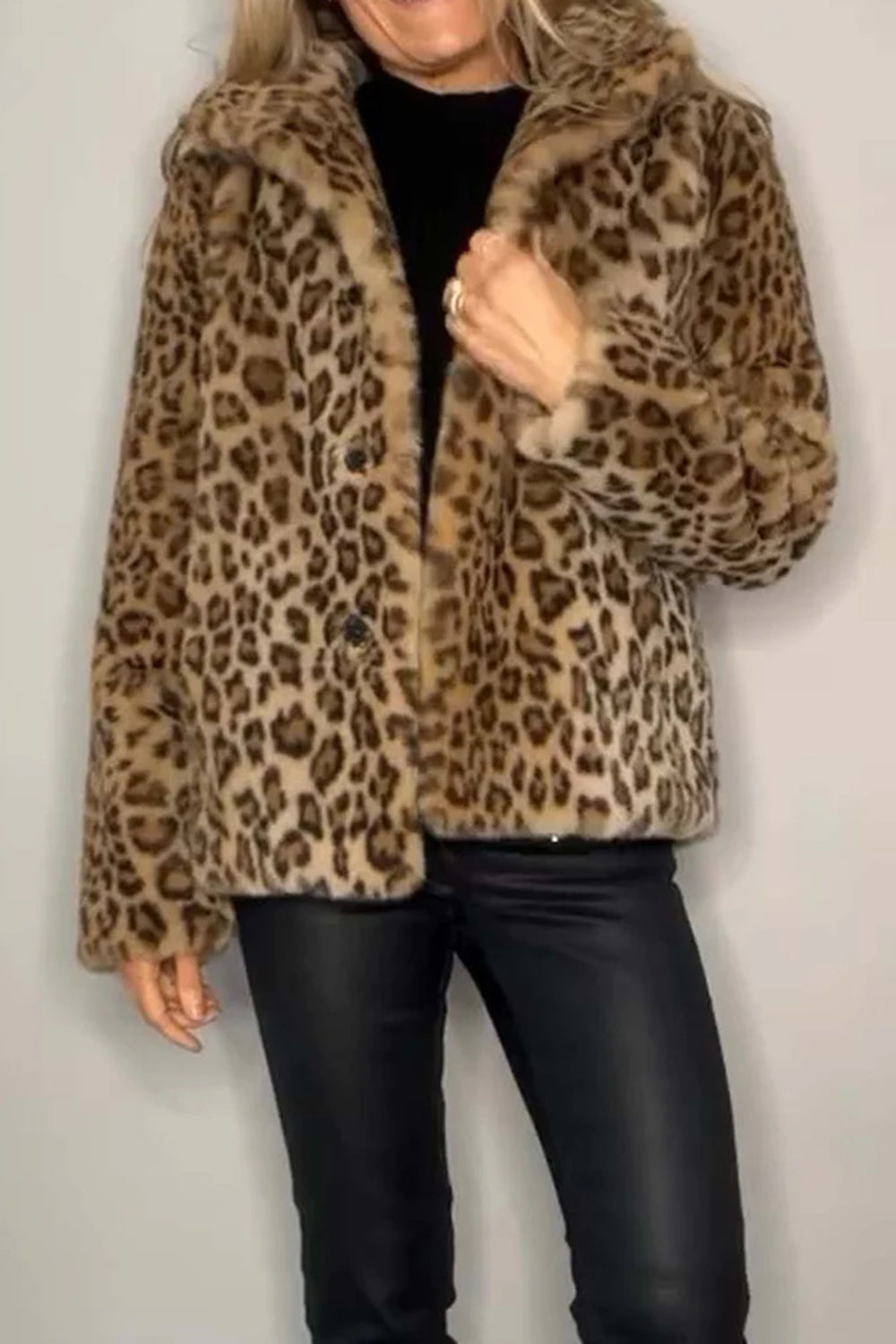 Leopard print faux fur collar coat with button closure and plush trim.