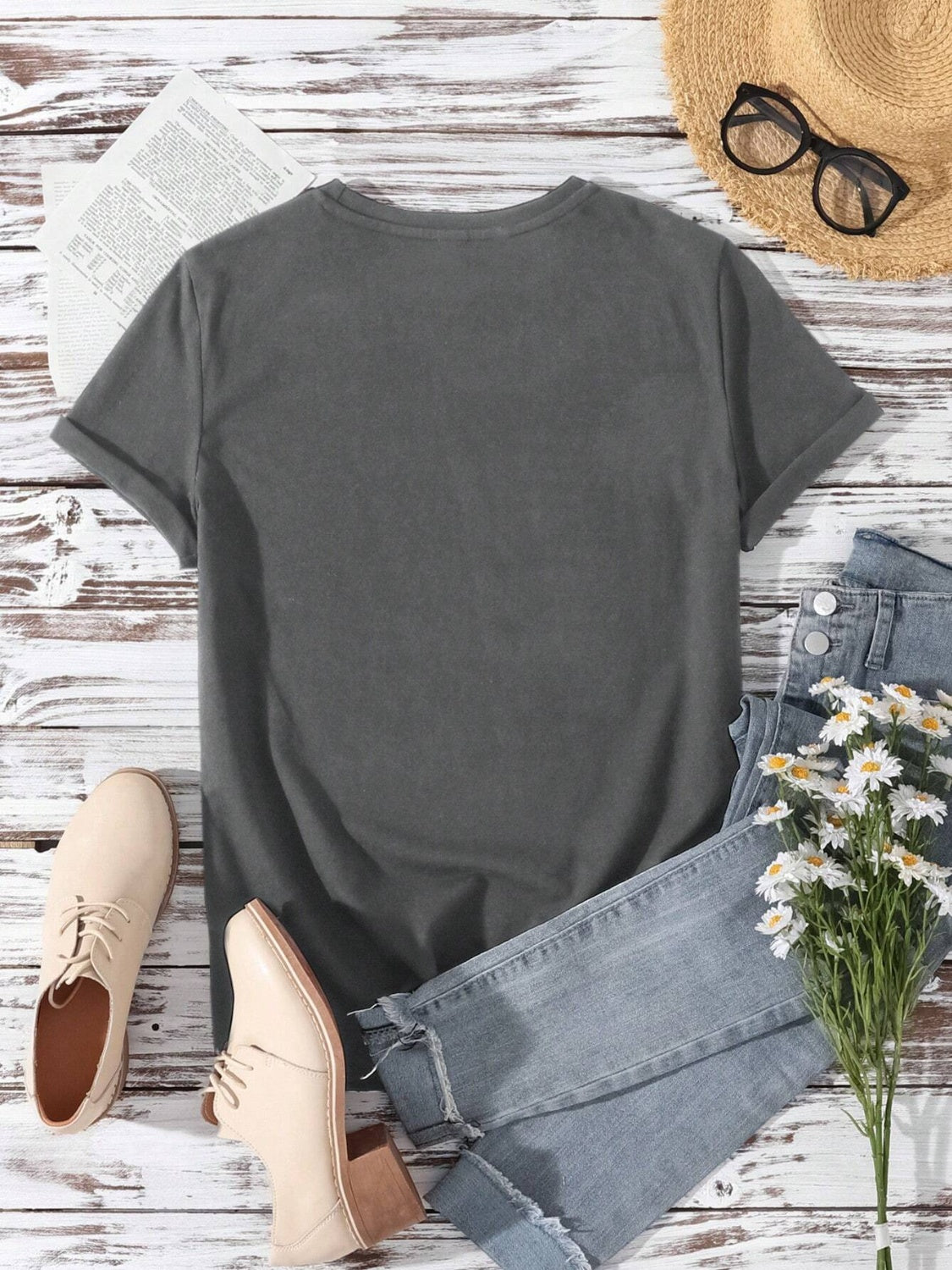 Dark gray basic t-shirt with rolled sleeves and a crew neck, styled with jeans and shoes.
