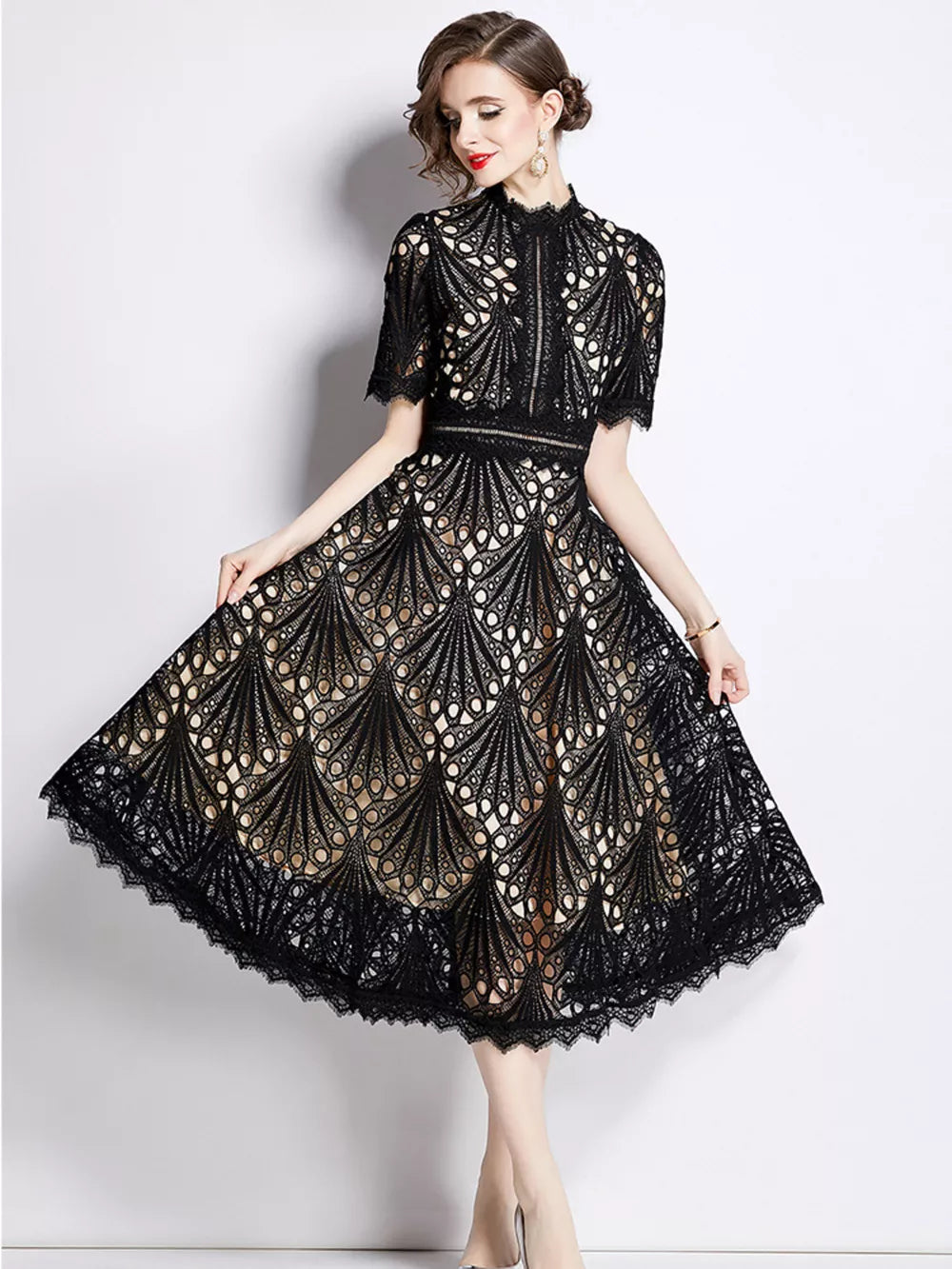 Elegant black lace midi dress with delicate sleeves and a-line skirt.