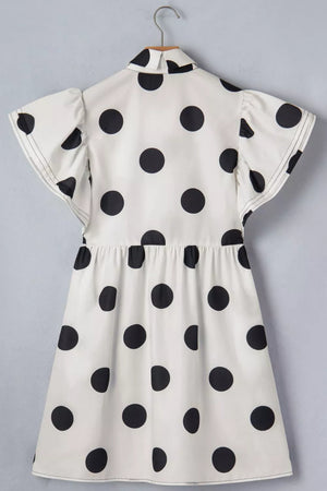 White polka dot mini dress with collared neckline and ruffled sleeves.