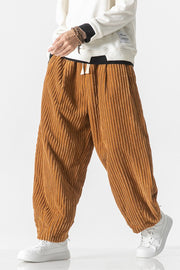 Relaxed fit corduroy wide-leg cargo pants in orange with a drawstring waist.