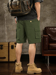 Army green cargo shorts with drawstring comfort and multiple pockets.