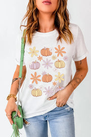 White t-shirt with a groovy pumpkin and flower graphic print.