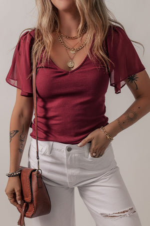 Burgundy ribbed knit top with V-neck and flutter sleeves