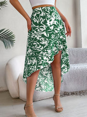 Dark green floral print midi skirt with an asymmetric hem and ruffle detail