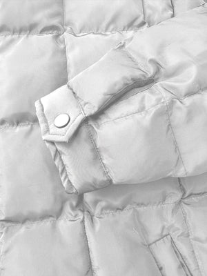 Quilted bomber jacket sleeve detail with snap closure and stand collar fabric.