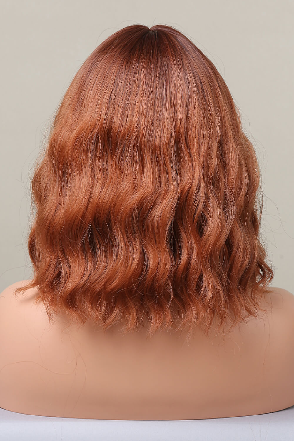 Rose Quartz bob wig in ochre with wavy texture and bangs