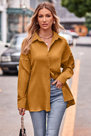 Textured mustard oversized shirt with button-down front and long sleeves.