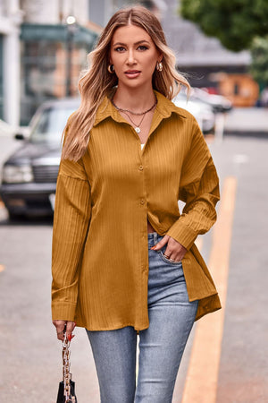 Textured mustard oversized shirt with button-down front and long sleeves.