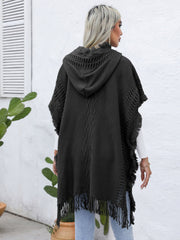 Dark gray textured knit poncho with fringe, hood, and diamond pattern detail.
