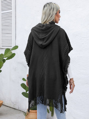 Dark gray textured knit poncho with fringe, hood, and diamond pattern detail.