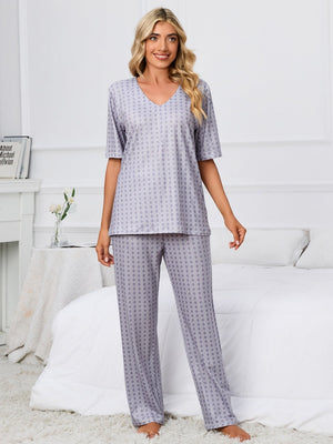 Geometric print V-neck lounge set in cloudy blue with short sleeves and straight leg pants.
