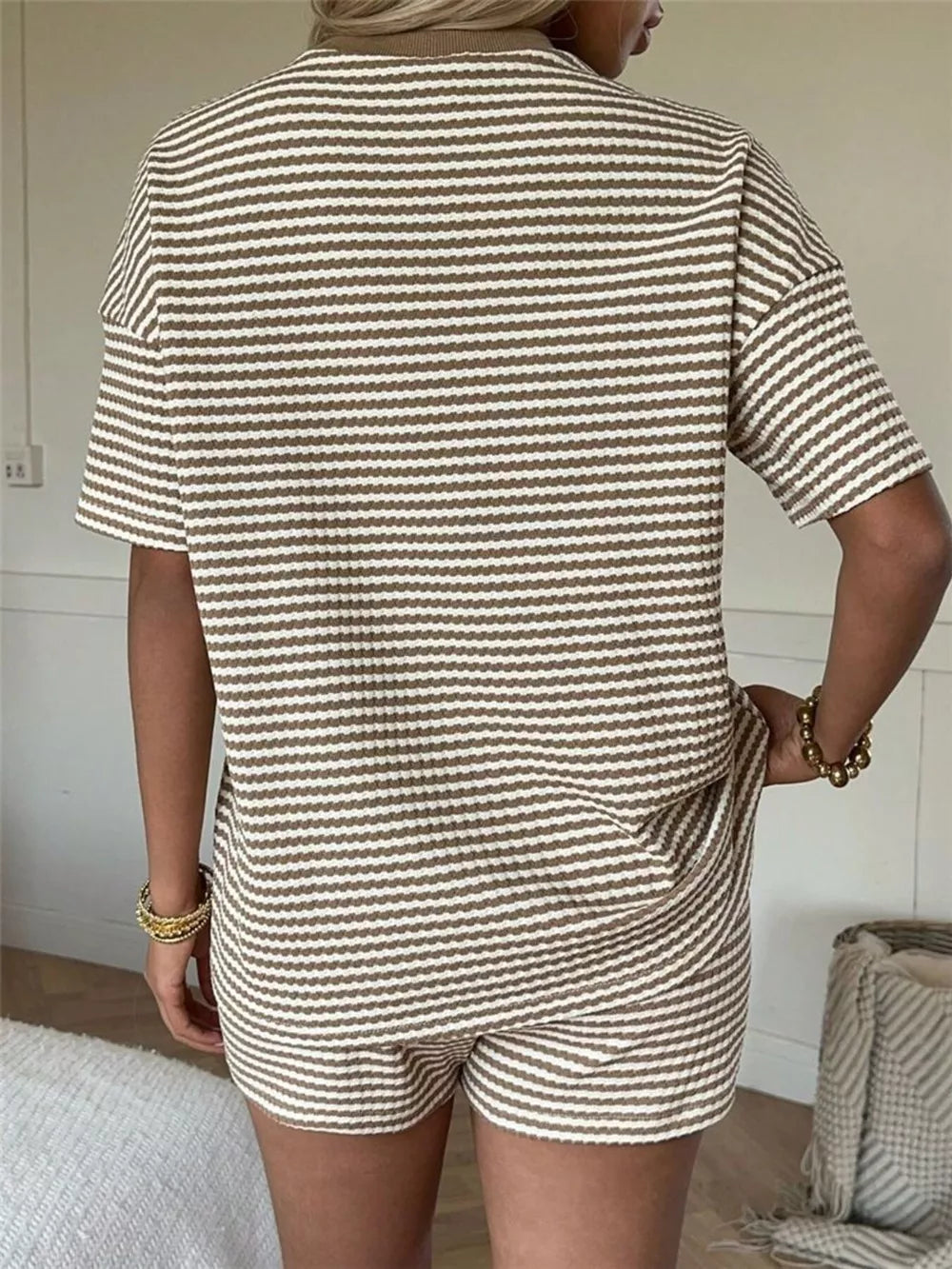 Striped two-piece set with drawstring shorts and short sleeve top in brown and white.