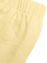 Yellow peplum hem two-piece set with button detail, elastic waistband detail