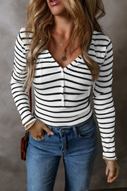 Ribbed stripe henley top with button placket and V-neck in black and white.