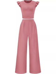 Pink ruffled cap sleeve maternity two-piece set with ruched waist top and wide-leg pants.