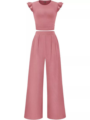 Pink ruffled cap sleeve maternity two-piece set with ruched waist top and wide-leg pants.