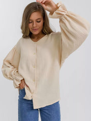 Ochre textured puff sleeve blouse with ruffled cuffs and button front
