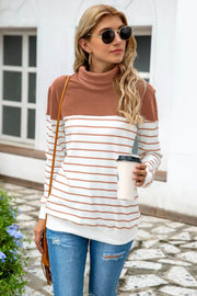 Colorblock stripe turtleneck knit sweater with camel and white stripes.